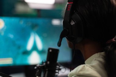 African american pro gamer talking with remote players