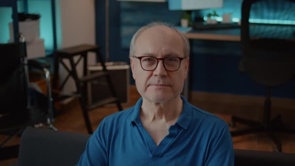 Portrait of senior man with injury smiling and looking at camera — Stock Video