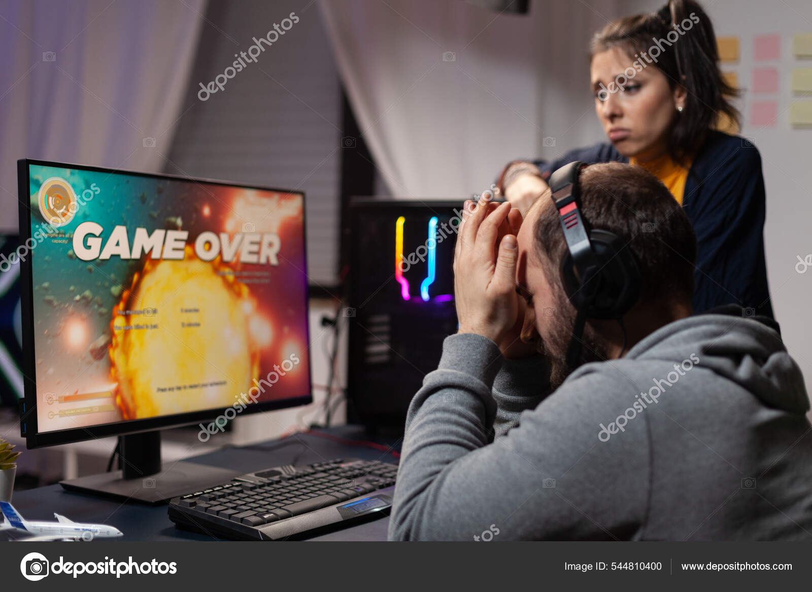 Free Photo  Gamer using controller to play online video games on computer.  man playing game with joystick and headphones in front of monitor. player  having gaming equipment, doing fun activity.