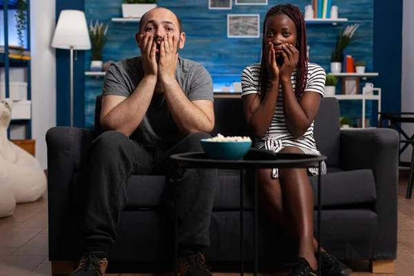 Terrified caucasian man and african american woman — Stock Photo, Image