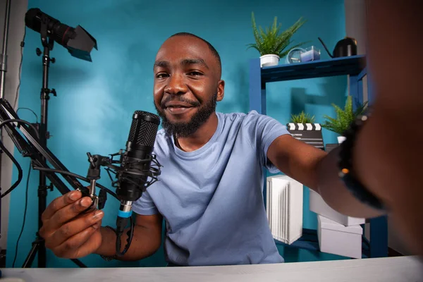 Smiling famous influencer taking wide angle selfie in online radio studio — Stock Photo, Image