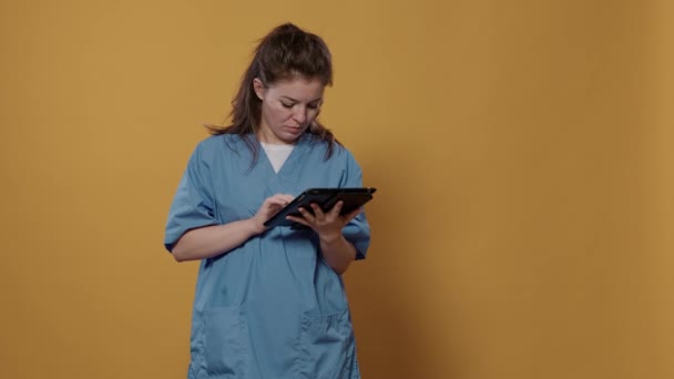 Portrait Woman Doctor Holding Tablet Typing Patient Data Wearing Hospital — Stock Video