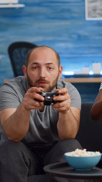 Modern interracial couple playing video game on TV — Stock Photo, Image