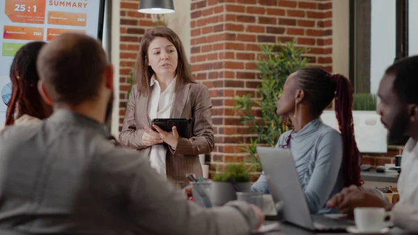 Close up of woman doing business presentation in boardroom — Stock Photo, Image