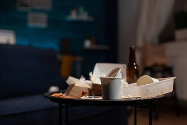 Empty messy living room with trash cans and leftovers rubbish — Stock Photo, Image