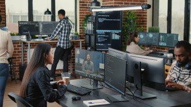 Software company employee in video call conference with business owner discussing coding project deadline