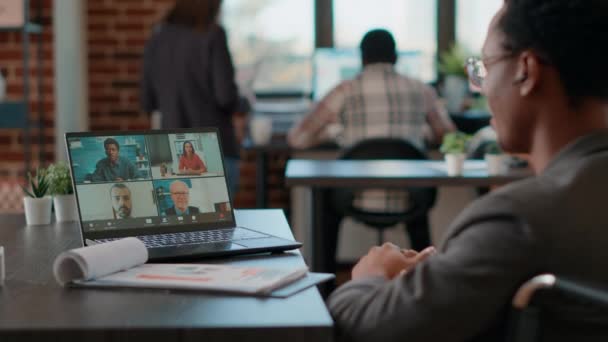 African american man talking to colleagues on videocall meeting — Stock Video