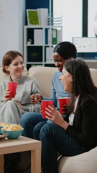 Colleagues having fun with drinks and snacks after work — Stock Photo, Image