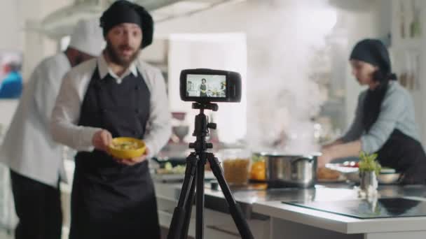 Professional camera recording video of cooking show — стоковое видео