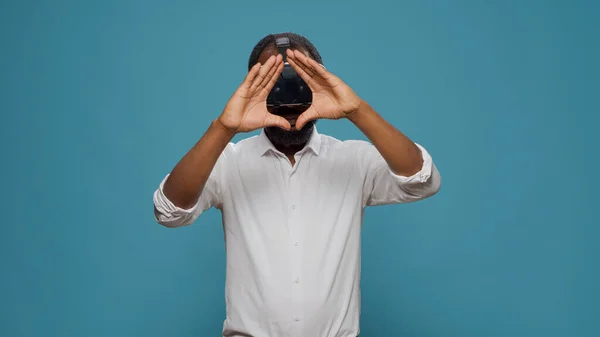 Modern person playing with electronic virtual reality headset — Stock Photo, Image