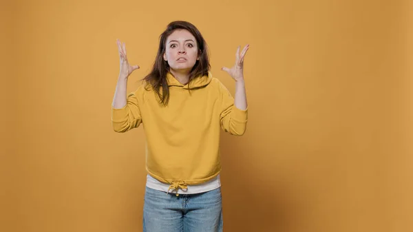 Portrait of angry woman feeling frustrated and mad doing exasperated hand gesture — Stock Photo, Image