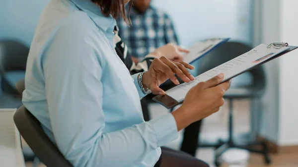 Recruitment applicant receiving cv papers from female employee — Stock Photo, Image