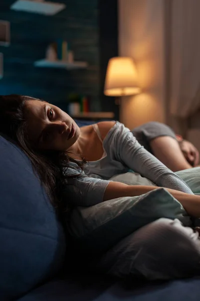 Depressed sad man and woman laying on couch in despair — Stock fotografie