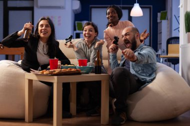 Business people celebrating video games play win in office