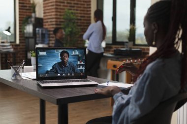 Research and development company team leader in videocall remote conference with CEO.