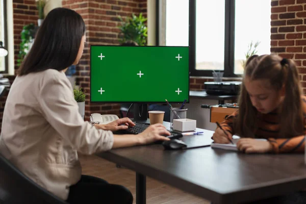 Young businesswoman using work computer with blank mock up template. — Stok fotoğraf