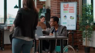 Man and woman discussing about business charts statistics