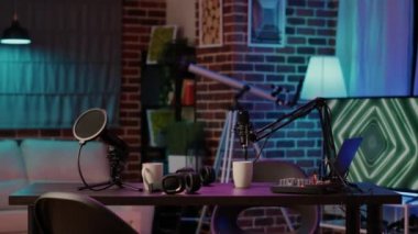 Empty vlogger desk with professional streaming equipment to broadcast live talk show