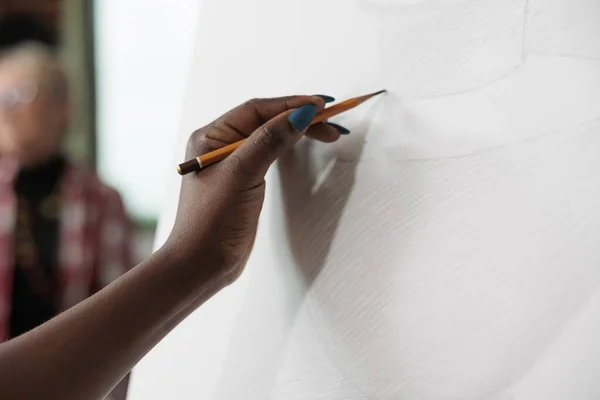 Close up of artist student drawing vase model on canvas — Stockfoto