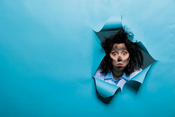 Crazy mad scientist with funny face expressions, wacky hair and dirty face after chemical explosion. — стоковое фото