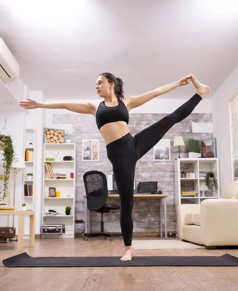 Caucasian young woman doing a beautiful yoga pose — Foto Stock