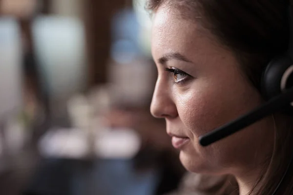 Telemarketing sales worker answering client call on headset — Foto Stock