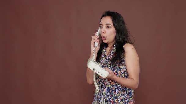Indian woman using landline phone call to have remote conversation — Video Stock