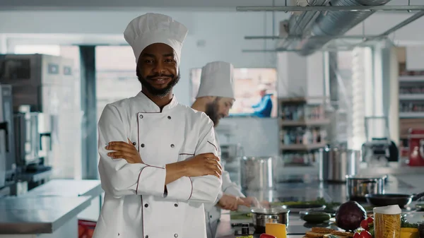Portrait of confident man working as chef in gourmet kitchen —  Fotos de Stock
