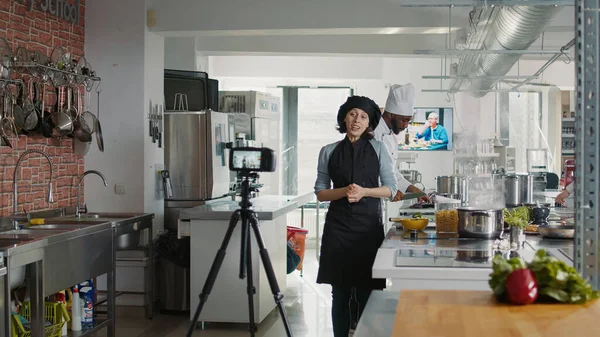 Authentic chef filming online cooking show in restaurant kitchen —  Fotos de Stock