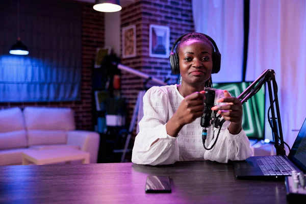 POV of woman influencer creating podcast content in studio — Stock fotografie