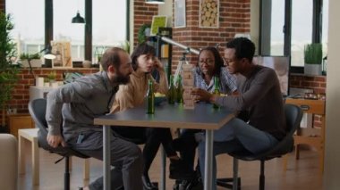 Multiethnic group of people having fun with tower pieces