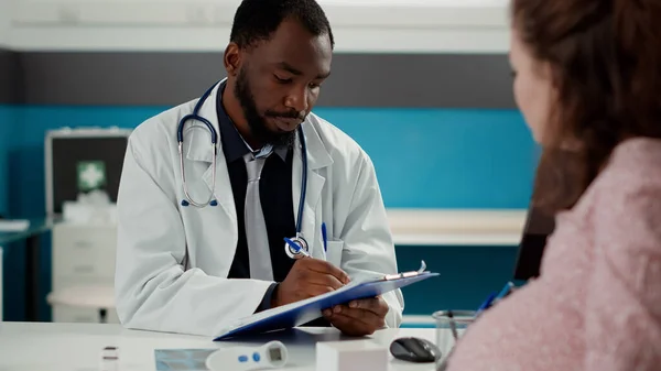 African American Medic Taking Notes Consultation Pregnant Person Writing Checkup — Stock Photo, Image