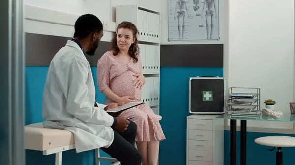 Male Physician Taking Notes Checkup Files Consultation Expectant Patient Having — Fotografia de Stock