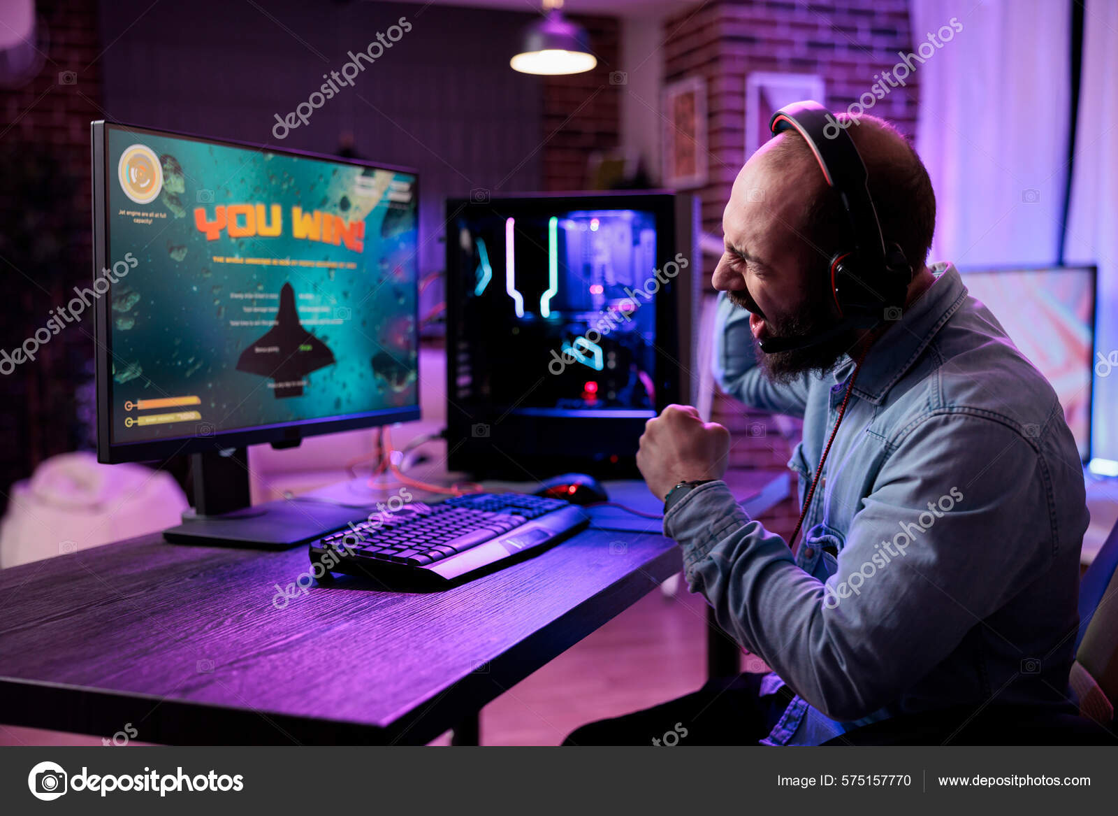 Adult using keyboard and mousepad to play video games on computer. Gamer  playing online game in