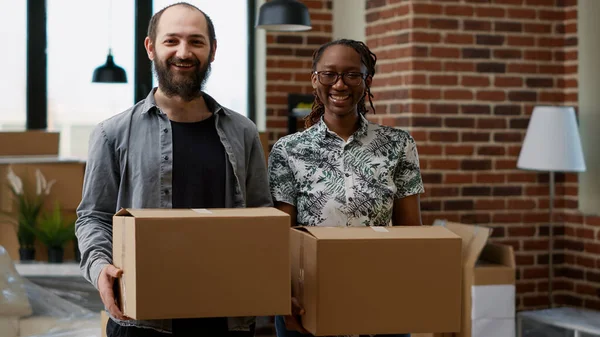 Portrait of husband and wife owning rented apartment flat to move in new household together. Home relocation in real estate property bought on mortgage loan to start family for future.