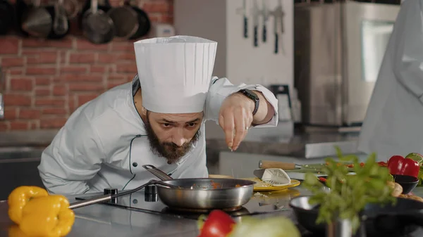 Male Chef Pouring Shredded Cheese Cooked Food Frying Pan Using —  Fotos de Stock