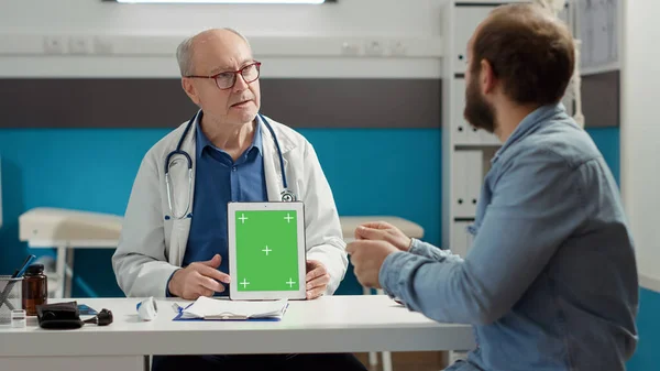 Senior Doctor Showing Greenscreen Digital Tablet Office Checkup Visit Gadget — Stockfoto