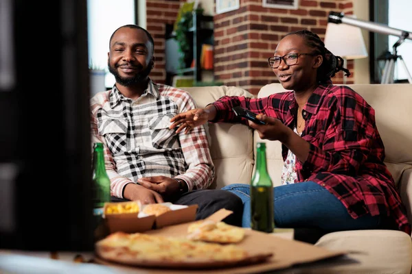 African American People Switching Channels Eating Takeaway Meal Fast Food — Stock Photo, Image