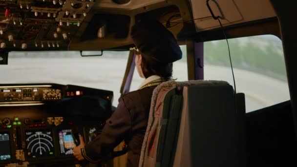 Portrait Woman Copilot Flying Airplane Captain Cockpit Using Control Panel — Stock Video