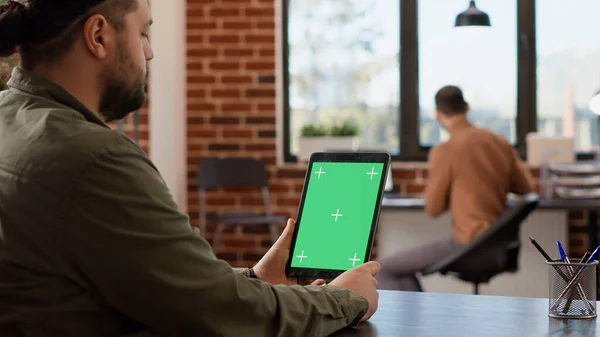 Male Freelancer Holding Digital Tablet Greenscreen Display Looking Blank Chroma — Stockfoto