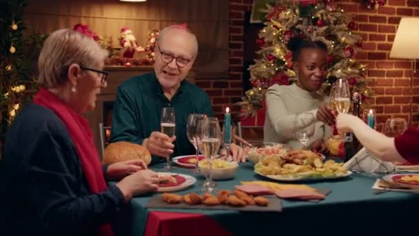 Happy Elderly Man Talking Wife While Enjoying Christmas Dinner Table — Wideo stockowe