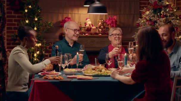 Happy Close Family Members Clinking Champagne Glasses While Sitting Together — Vídeo de stock