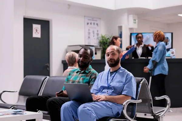Medical Nurse Talking Male Patient Diagnosis Showing Disease Results Laptop — Foto de Stock
