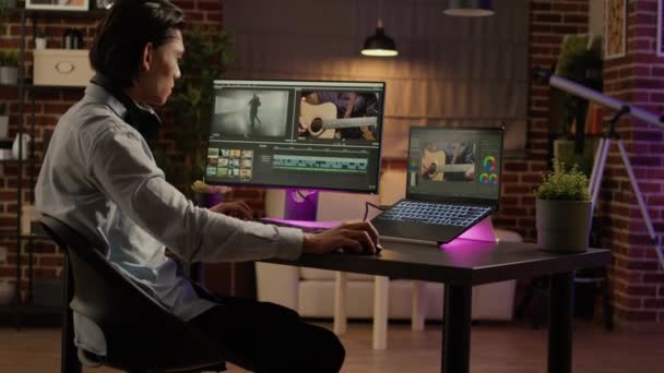 Asian Man Listening Music Editing Video Software Using Computer Work — Video Stock