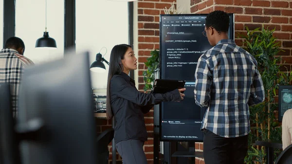 Team Coders Analyzing Code Wall Screen Comparing Errors Using Digital — Zdjęcie stockowe