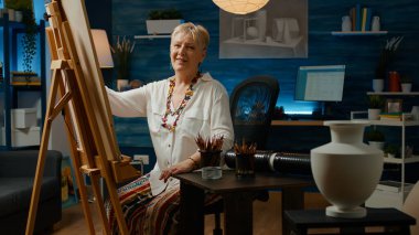 Old artist using vase model to draw authentic masterpiece on canvas with pencils and artistic tools. Drawing creative artwork sketch with imagination and creativity, art and craft hobby.