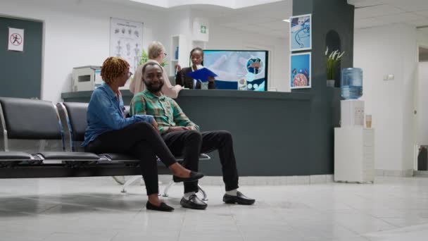 African American Man Woman Talking Disease Hospital Reception Lobby Waiting — 图库视频影像