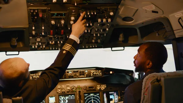 Team Diverse Captain Copilot Preparing Takeoff Airplane Pushing Navigation Buttons — Stock Fotó