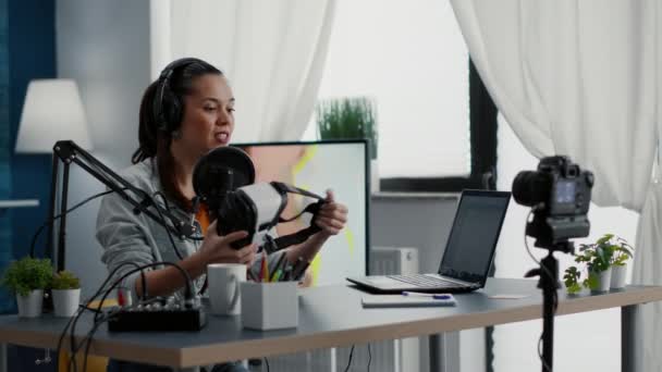 Famous Influencer Reviewing High Tech Headset While Filming Recommendation Video — Video