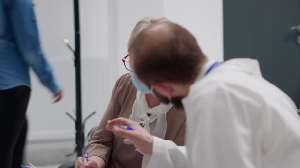 Senior Patient Specialist Face Masks Talking Virus Prevention Waiting Room — Stockvideo